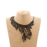 Paguro Upcycle recycled rubber leaf necklace with black layered leaf design on woven display bust