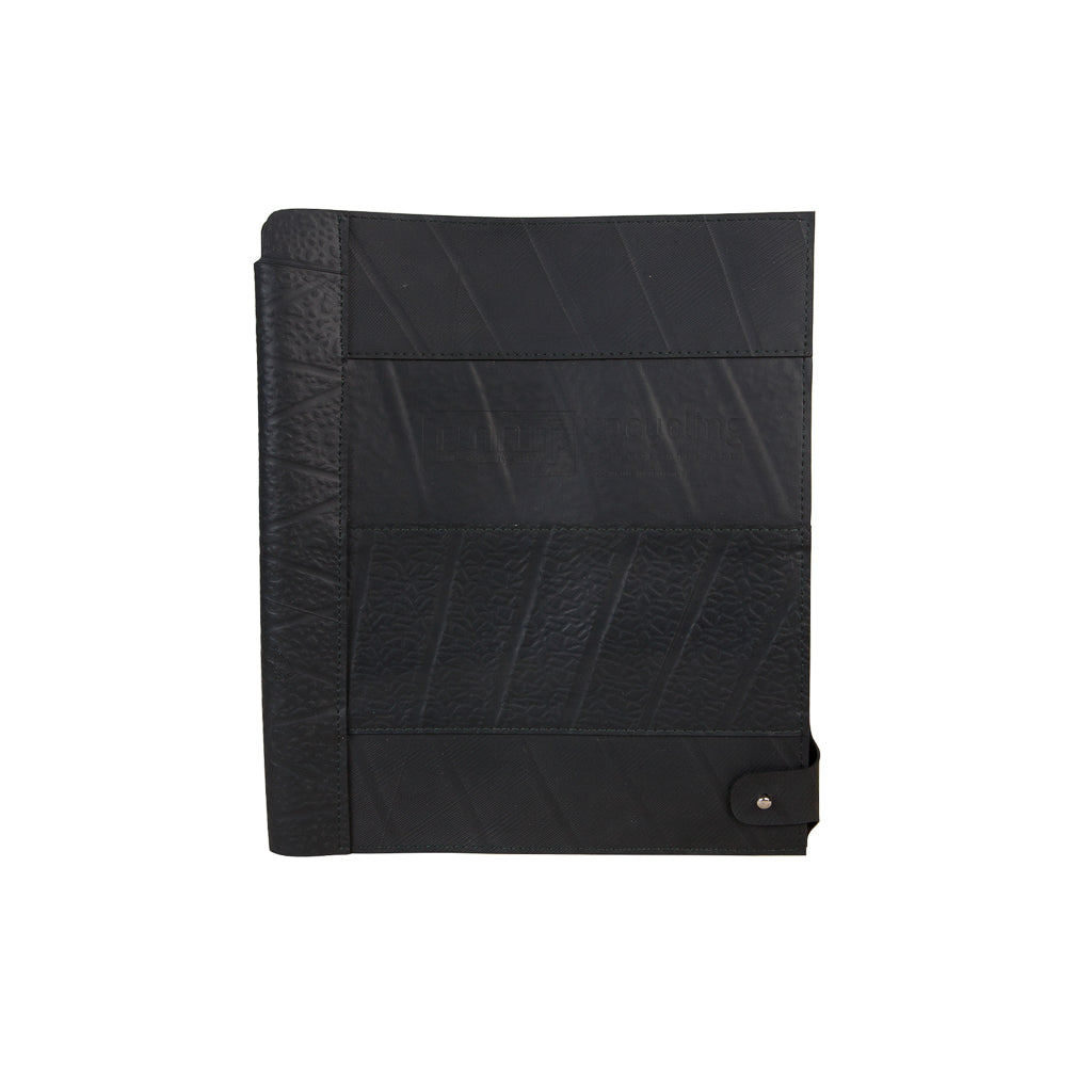 Paguro Upcycle recycled rubber notebook holder in black with textured patchwork design and snap closure