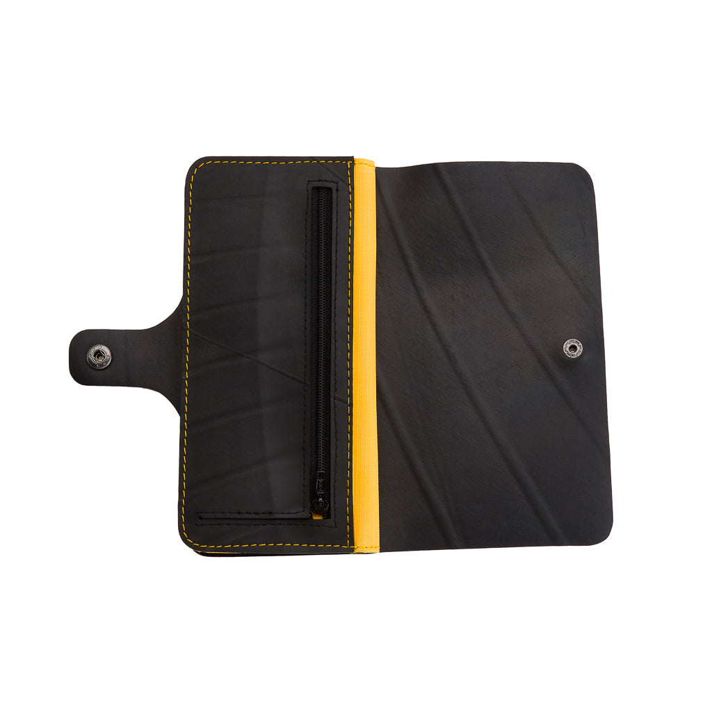 Open recycled rubber vegan purse by Paguro Upcycle with black and yellow interior and zipper pocket