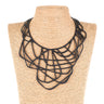 Paguro Upcycle black upcycled rubber necklace with intricate geometric design on display bust
