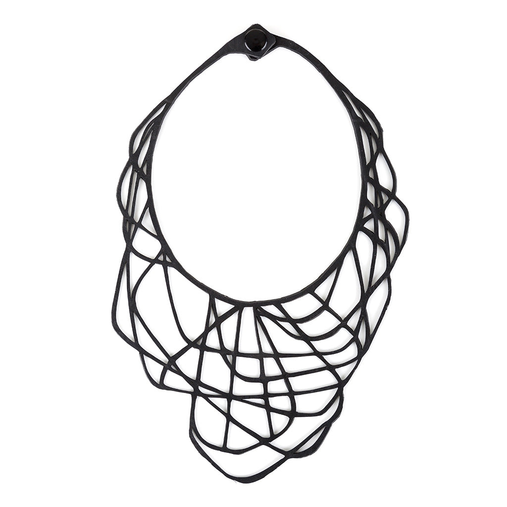 Paguro Upcycle black upcycled rubber necklace with intricate web-like design and button clasp