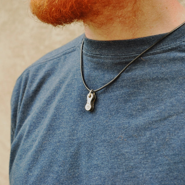 Paguro Upcycle recycled bike chain pendant necklace worn on a casual outfit